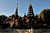 Old Bagan Myanmar. The Nat Taung monastery complex. The spires above the shrine rooms, below a masonry wall. 